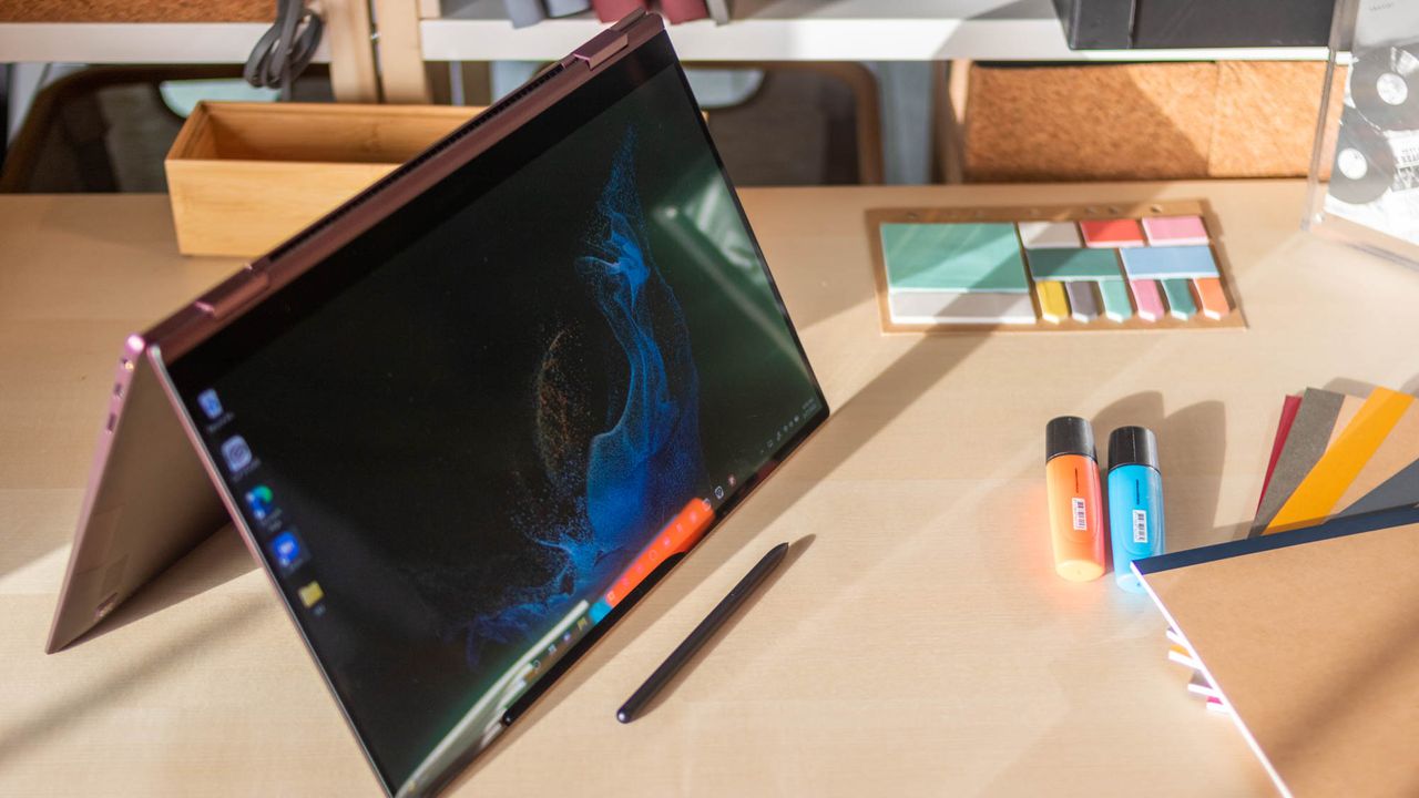 A photograph of the Samsung Galaxy Book2 Pro 360 on a table in tent mode