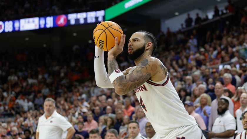 Johni Broome no.4 of the Auburn Tigers makes a three-pointer to tie a game in overtime in March 2025