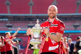 FA Cup dates 2024/25: Christian Eriksen of Manchester United holds the FA Cup trophy, 2024