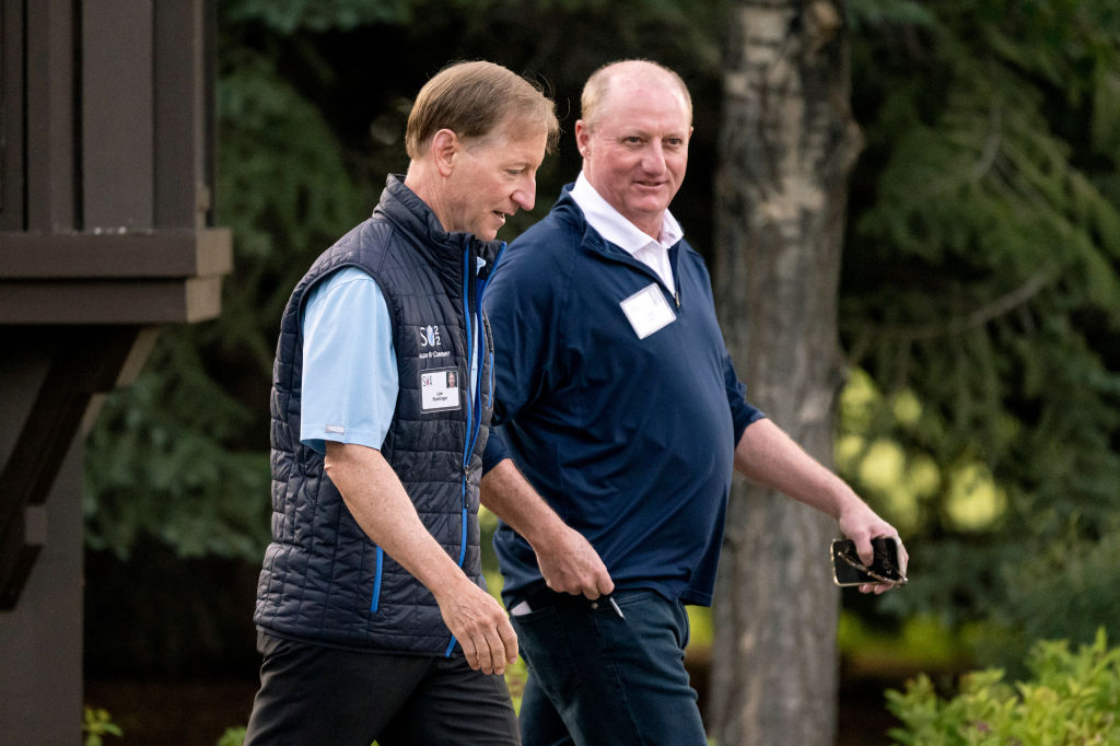 Lee Styslinger, co-chairman of Altec Inc., left, and Greg Abel, chairman of Berkshire Hathaway Energy, walk to the morning session at the Allen &amp; Co. Media and Technology Conference in Sun Valley, Idaho, US, on Thursday, July 11, 2024.