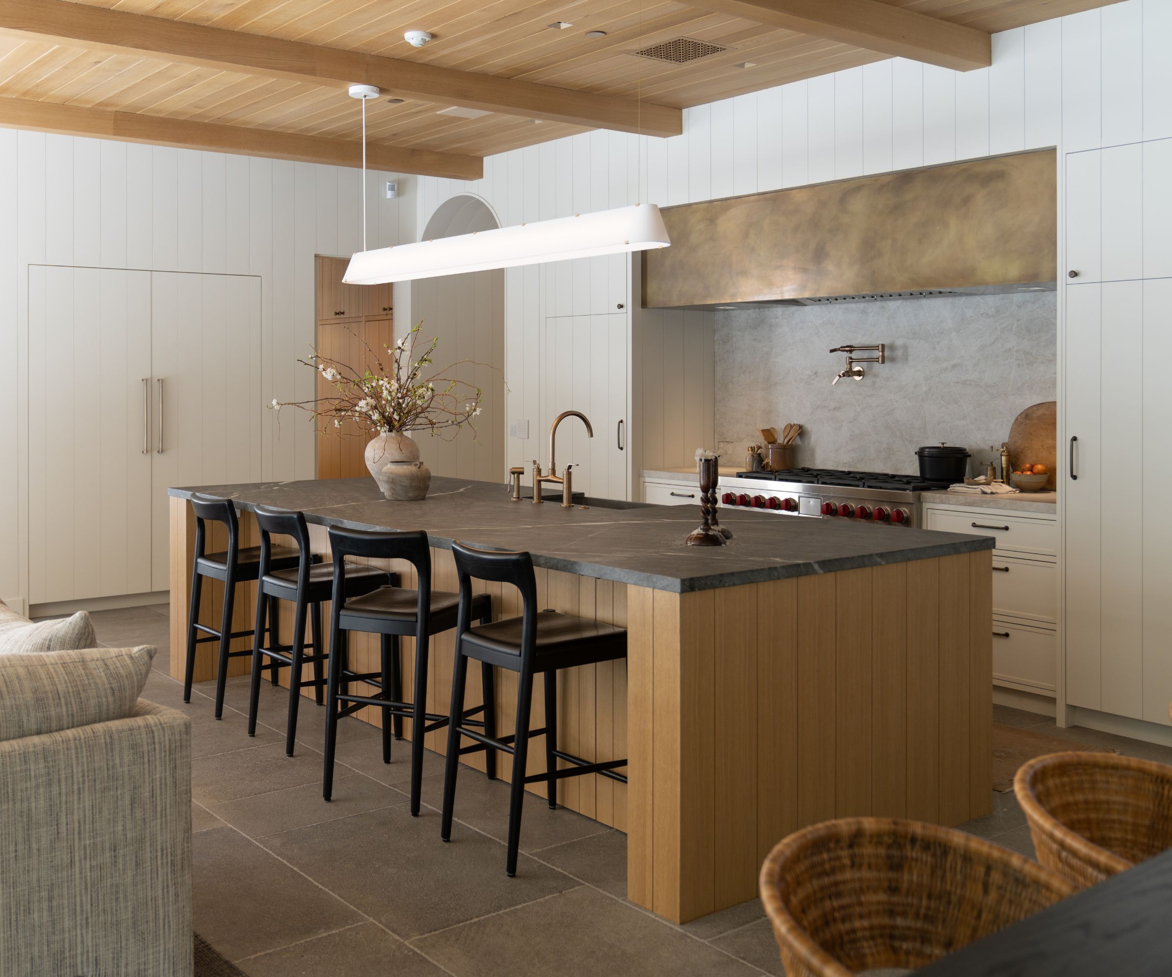 kitchen with island and brass extractor hood