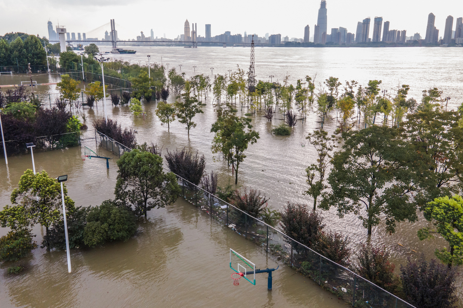 This aerial photo taken on July 28, 2020 shows a flooded sports ground along the Yangtze River in Wuhan in China's central Hubei province.