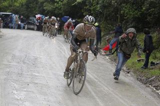 Cadel Evans (BMC) pushes the pace on the muddy Strada Bianche.