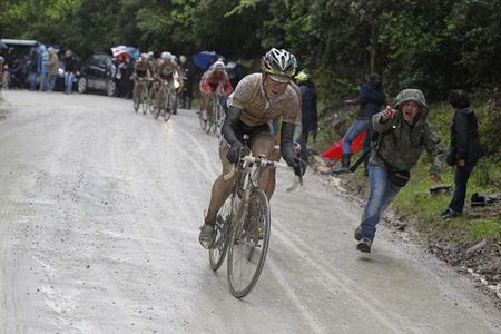 Cadel Evans (BMC) pushes the pace on the muddy Strade Bianche.
