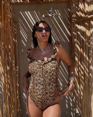 Lena wearing leopard print swimsuit