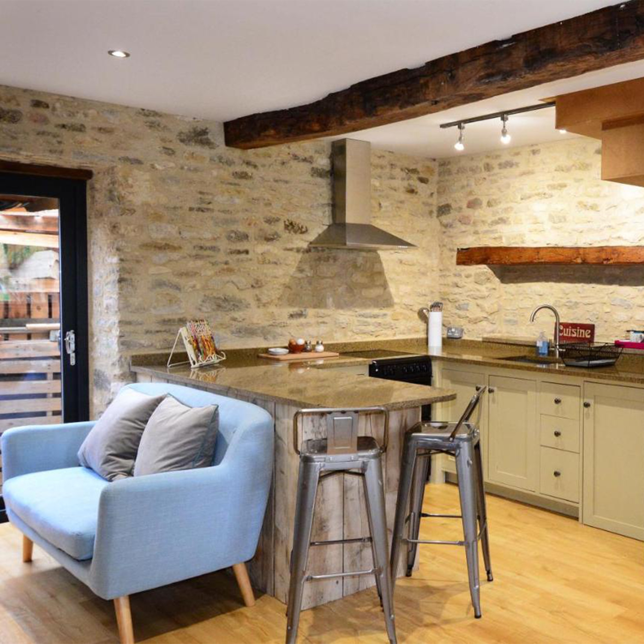 Kitchen area with sofa in cottage