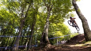 Jim Monro of Great Britain competes during the men's downhill final at the UCI Mountain Bike World Cup 2022 ahead of the 2024 edition of the event