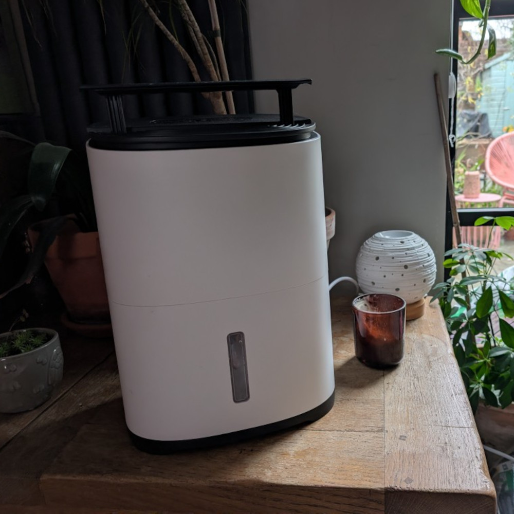 meaco arete one 6L dehumidifier on a table in a house
