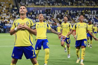 RIYADH, SAUDI ARABIA - SEPTEMBER 27: Cristiano Ronaldo of Al-Nassr celebrates scoring his side's second goal during the Saudi Pro League match between Al Nassr FC v Al-Wehda FC at Al-Awwal Stadium on September 27, 2024 in Riyadh, Saudi Arabia. (Photo by Al Nassr FC/Al Nassr FC via Getty Images)