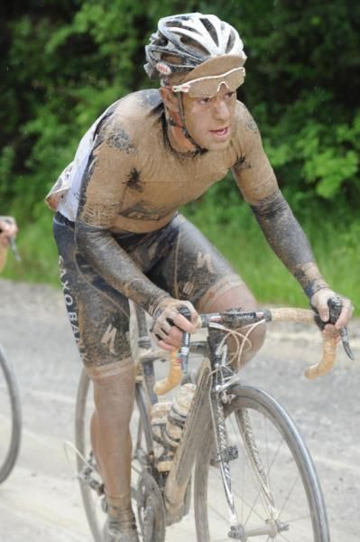 Somewhere underneath all that mud is Porte wearing the maglia bianca