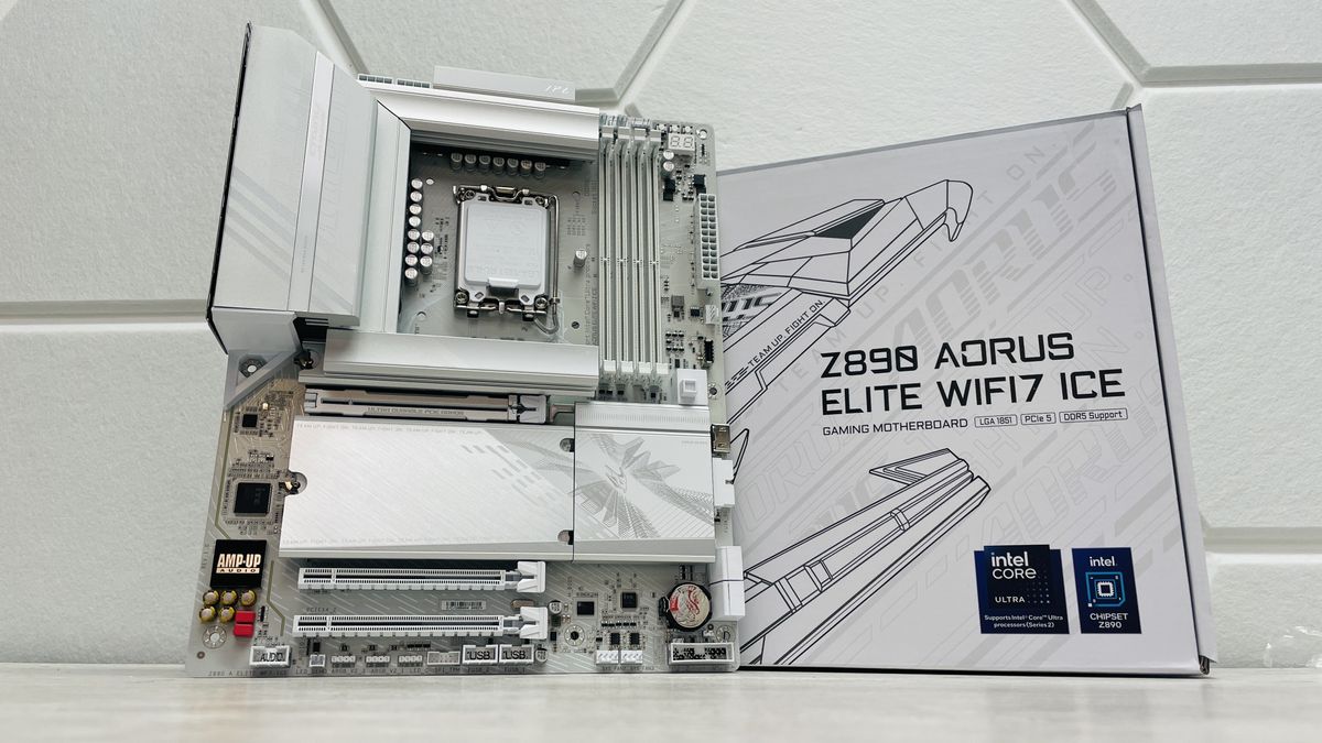 Gigabyte Z890 Aorus Elite WiFi 7 Ice on a light desk with a white background and SSD covers removed.