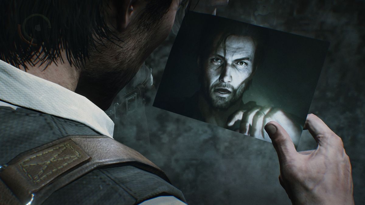 Sebastian staring at a photo of himself.