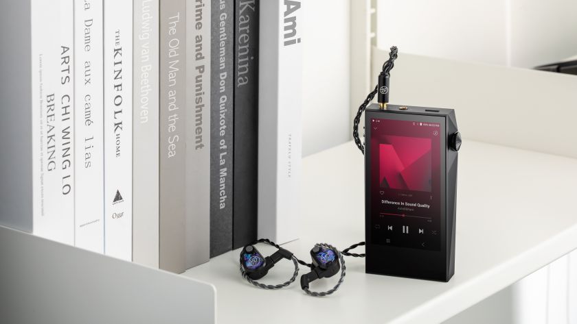 Astell &amp; Kern A&amp;Ultima SP3000M next to books