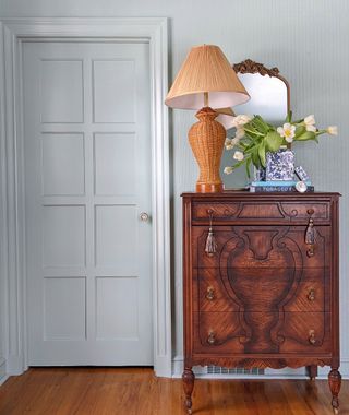 Wicker lamp on mahogany dresser