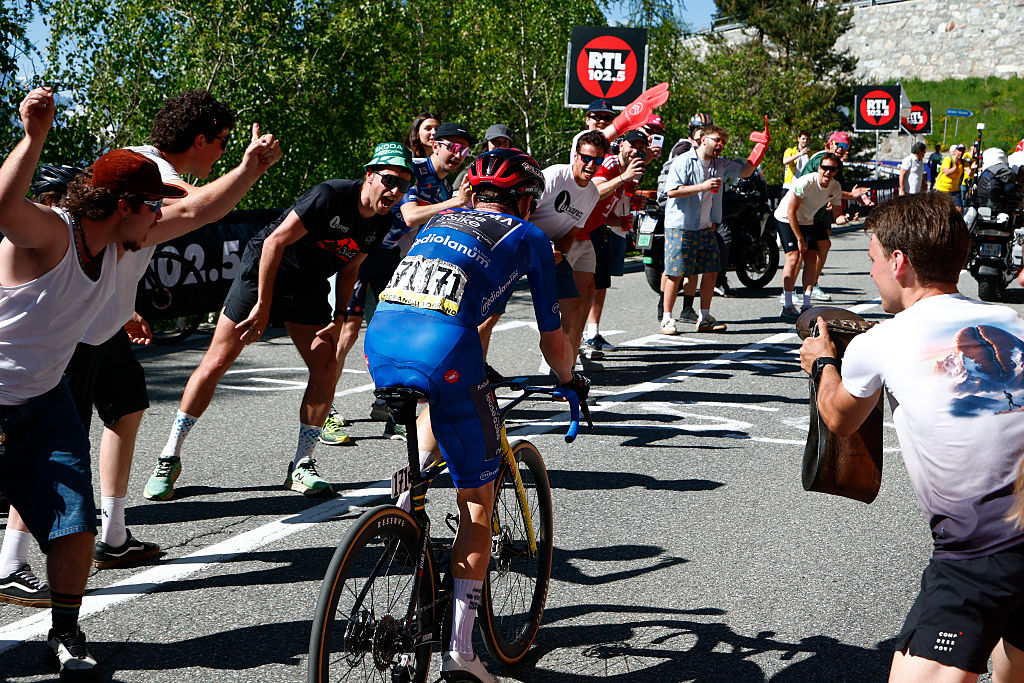 Team Visma Lease a Bike Danish rider Jonas Vingegaard climbs to win the 14th stage of the Giro d'Italia 2026 - Tour of Italy cycling race between Aosta and Pila (Gressan), Italy, on May 23, 2026. (Photo by Luca Bettini / AFP)