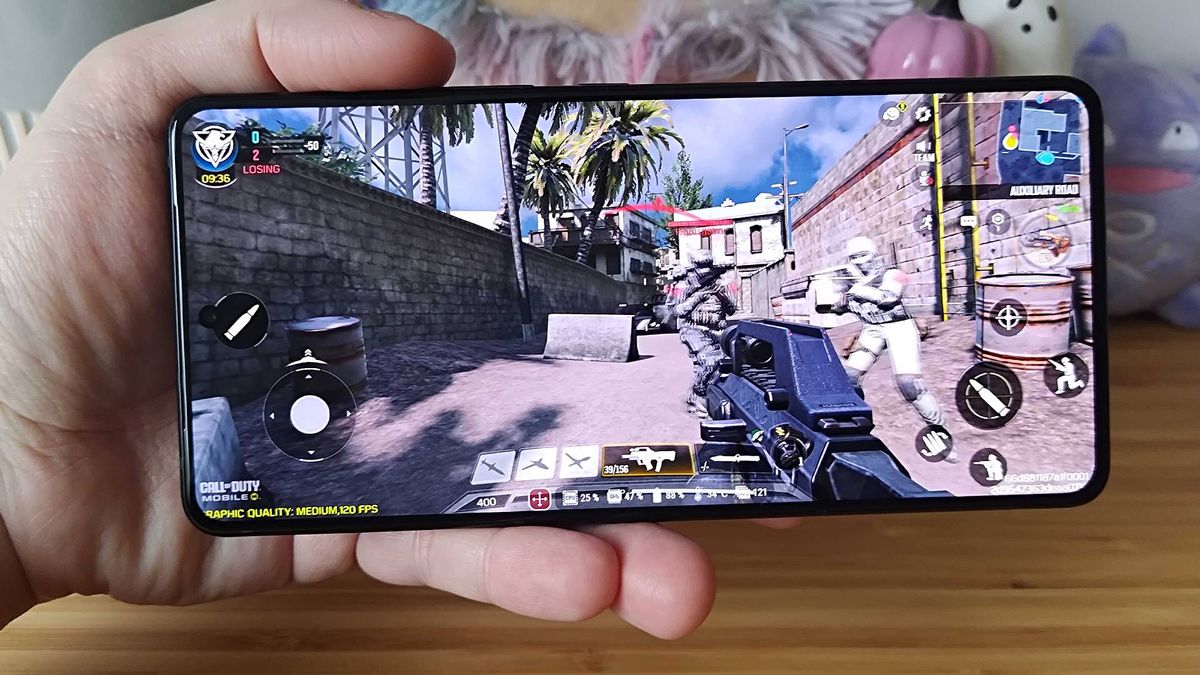 Asus ROG Phone 9 Pro with Call of Duty mobile gameplay on screen
