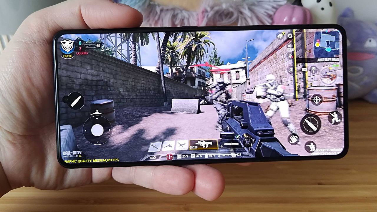 Asus ROG Phone 9 Pro with Call of Duty mobile gameplay on screen