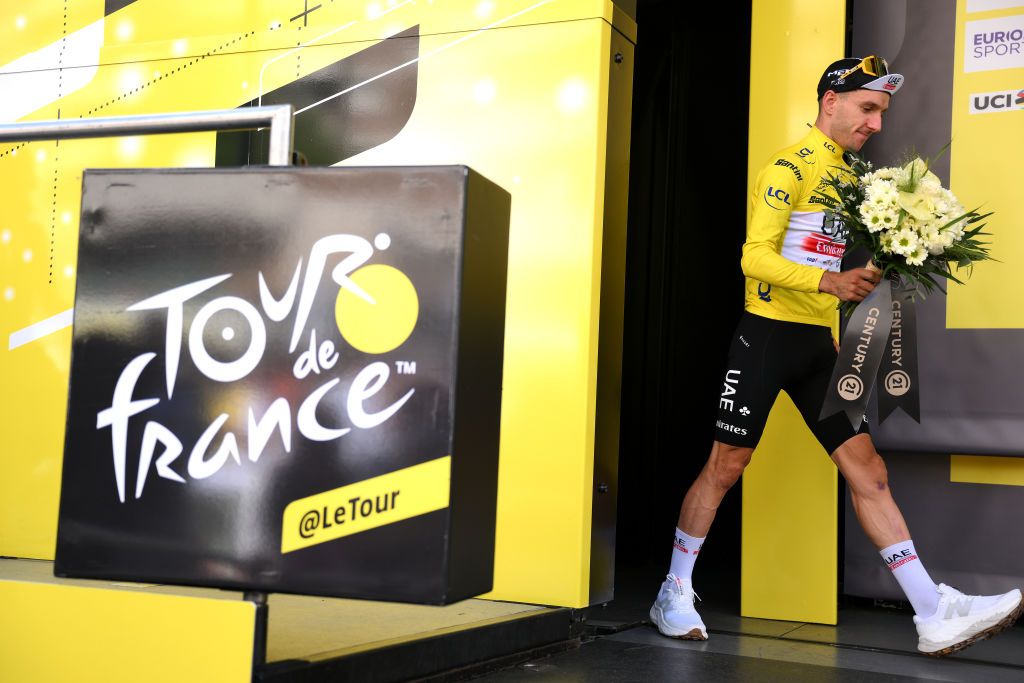 BILBAO SPAIN JULY 01 Adam Yates of United Kingdom and UAE Team Emirates celebrates at podium as Yellow Leader Jersey winner during the stage one of the 110th Tour de France 2023 a 182km stage from Bilbao to Bilbao UCIWT on July 01 2023 in Bilbao Spain Photo by David RamosGetty Images