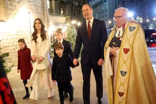 Princess Charlotte of Wales, Catherine, Princess of Wales, Prince Louis of Wales, Prince George of Wales, Prince William, Prince of Wales and The Dean of Westminster Abbey, The Very Reverend Dr David Hoyle attend The "Together At Christmas" Carol Service at Westminster Abbey on December 08, 2023 in London,