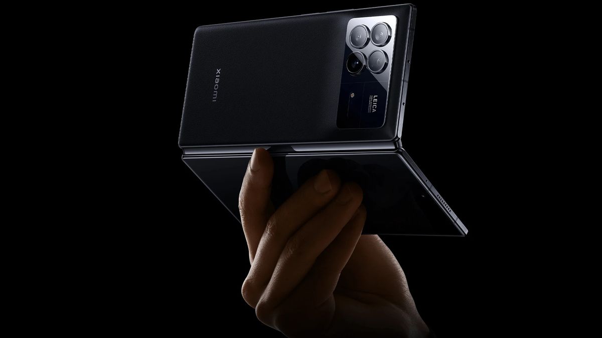 A press render of the Xiaomi Mix Fold 3 from the back in someone's hand