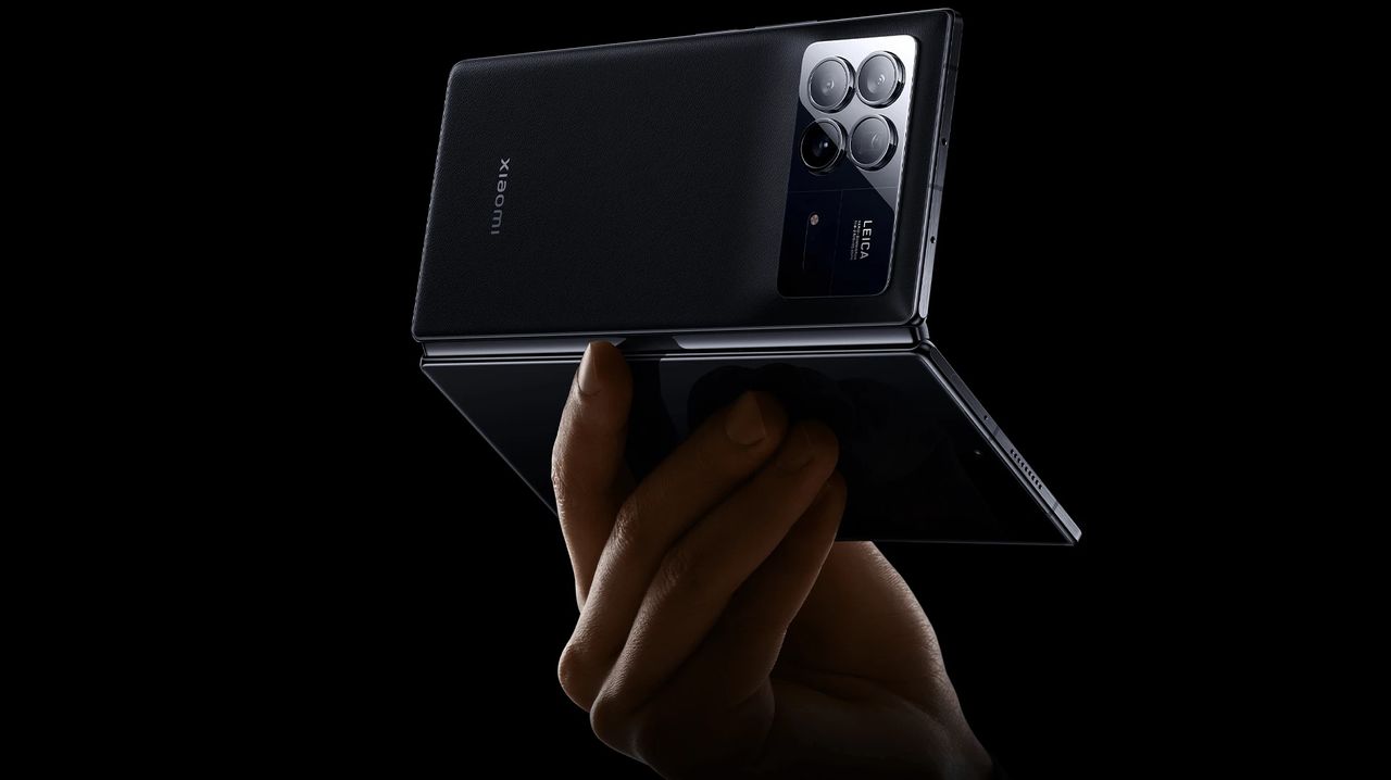 A press render of the Xiaomi Mix Fold 3 from the back in someone's hand