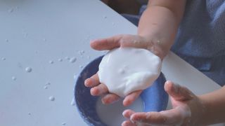 a child playing with oobleck