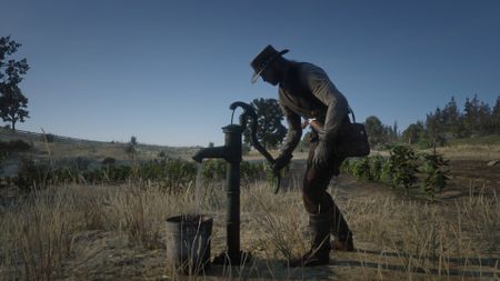 Red Dead Redemption 2 screenshot of John Marsten pumping water out into a bucket on Beecher's Hope farm