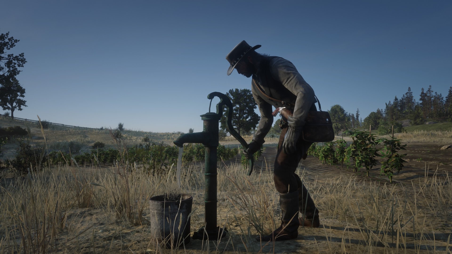 Red Dead Redemption 2 screenshot of John Marsten pumping water out into a bucket on Beecher&#039;s Hope farm
