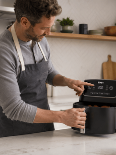 Sharkninja Guy using an air fryer 