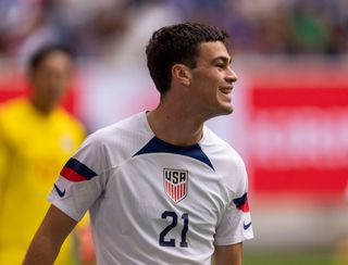 Gio Reyna #21 of the United States reacts to a missed chance during a game between Japan and USMNT at Düsseldorf Arena on September 23, 2022 in Düsseldorf, Germany.