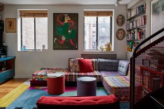 a colorful sofa in a small apartment