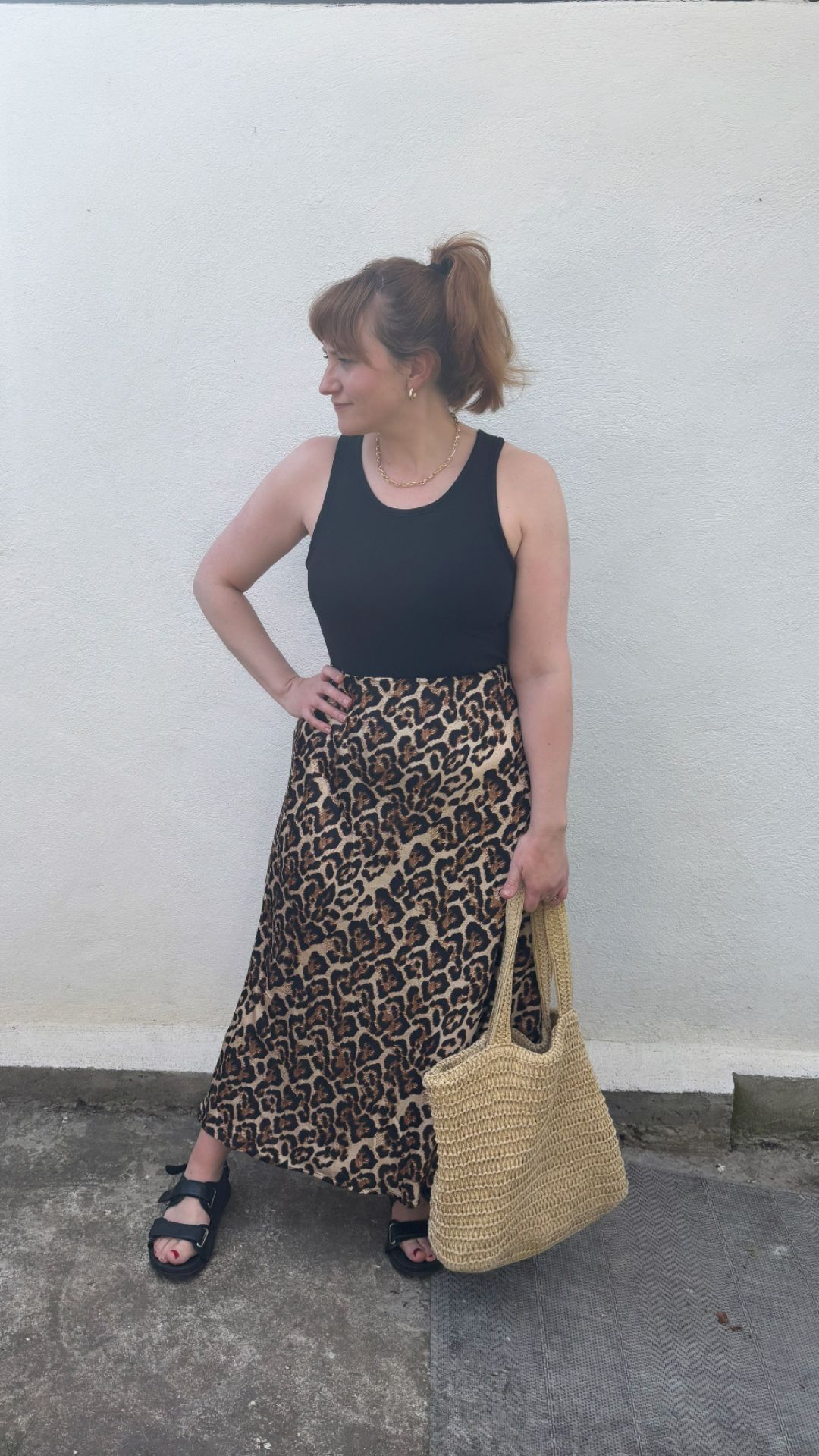 matilda wearing the black M&amp;amp;S vest with a leopard print skirt