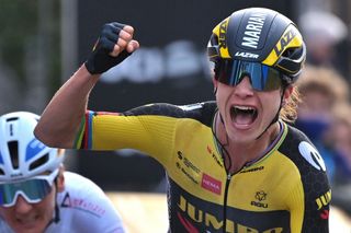 Dutch Marianne Vos celebrates as she crosses the finish line to win the womens edition of the GentWevelgem In Flanders Fields 2475 kilometers road cycling race from Ypers to Wevelgem on March 28 2021 Belgium OUT Photo by DAVID STOCKMAN various sources AFP Belgium OUT Photo by DAVID STOCKMANBelgaAFP via Getty Images