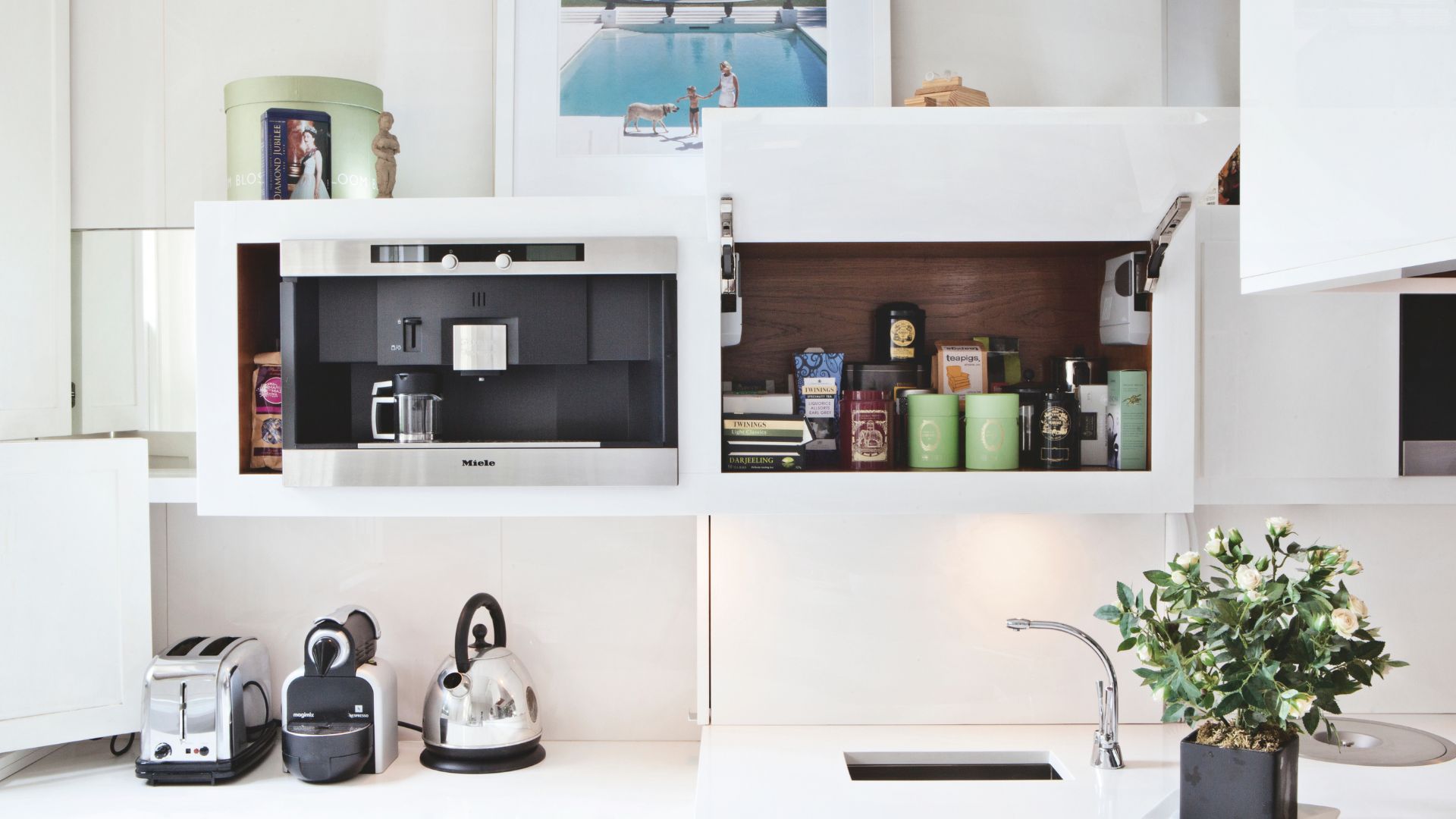 picture of coffee machine and cupboard with coffee accessories inside