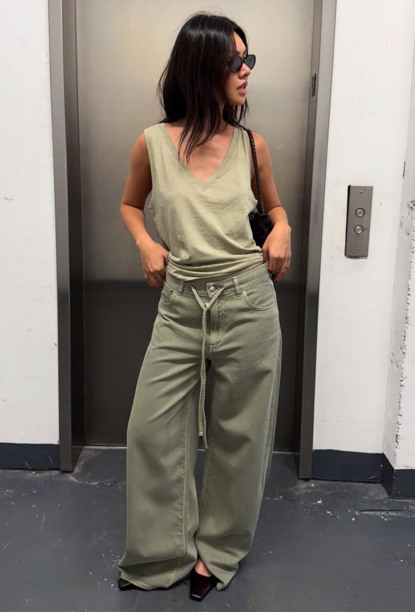 @mimixn wears a sage green top, khaki jeans, black ballet flats and sunglasses
