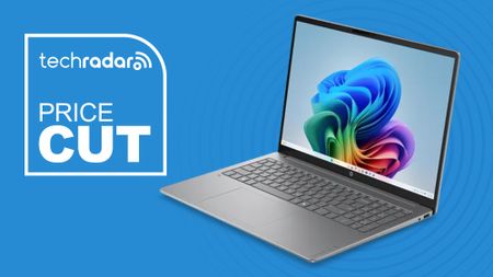 A HP laptop on a blue background next to a TechRadar badge that reads 'Price Cut'