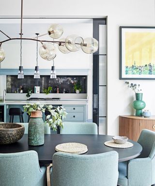 A light blue kitchen and dining room