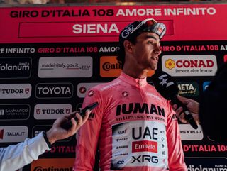 Isaac del Toro (UAE Team Emirates XRG) talks to media in Siena after he moved into the maglia rosa after Giro d'Italia stage 9