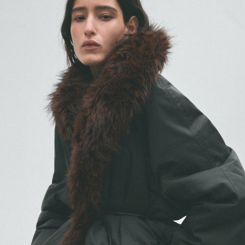 H&amp;M studio collection woman wearing fur lined coat