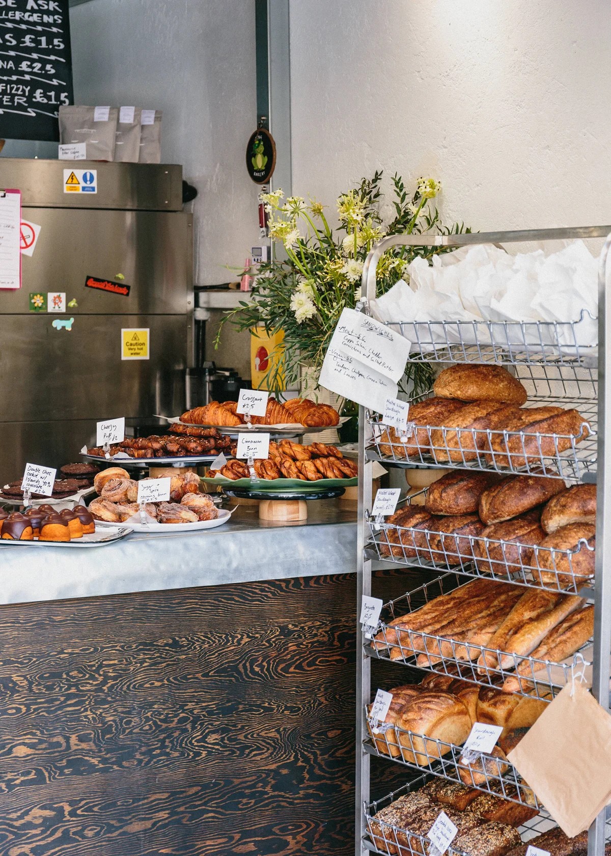 The colorful exterior and rustic-chic interiors and baked goods of a bakery.