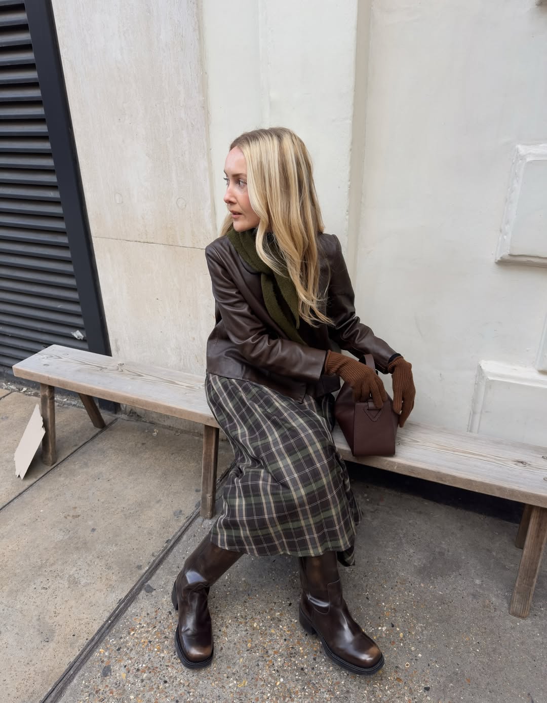 Chloe in shiny brown boots