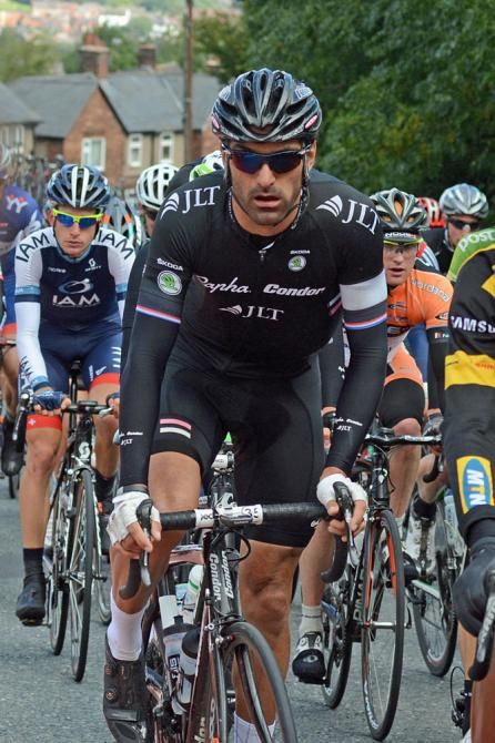 Kristian House climbs in the bunch