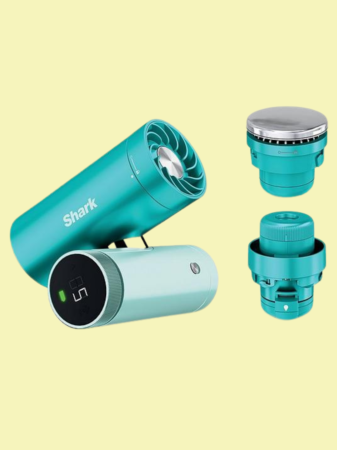 A teal handheld portable fan from Shark