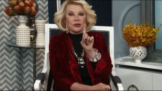 Joan Rivers talking and raising her hand up in Iron Man 3.