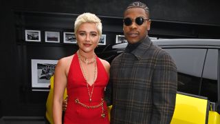 From left to right: Florence Pugh and John Boyega standing togehter.