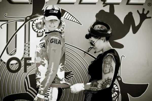 Heather Logan-Sprenger gets zipped up by a well decorated podium girl at the Tour of the Gila.