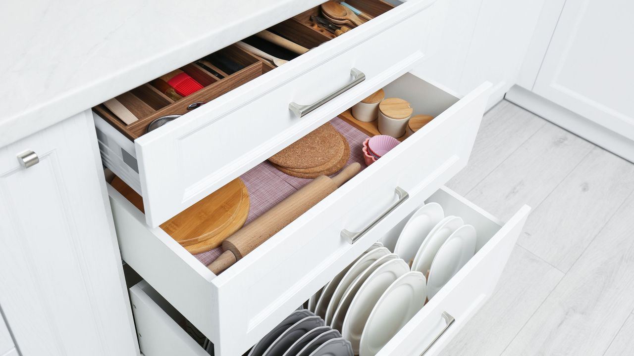 Open white kitchen drawers