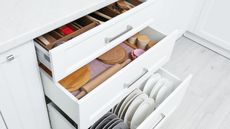 Open white kitchen drawers