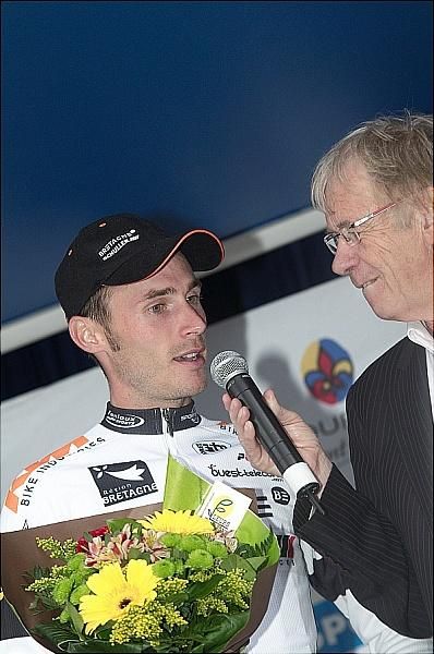 Paris-Bourges winner Florian Vachon (Bretagne-Schuller) is interviewed on the podium.