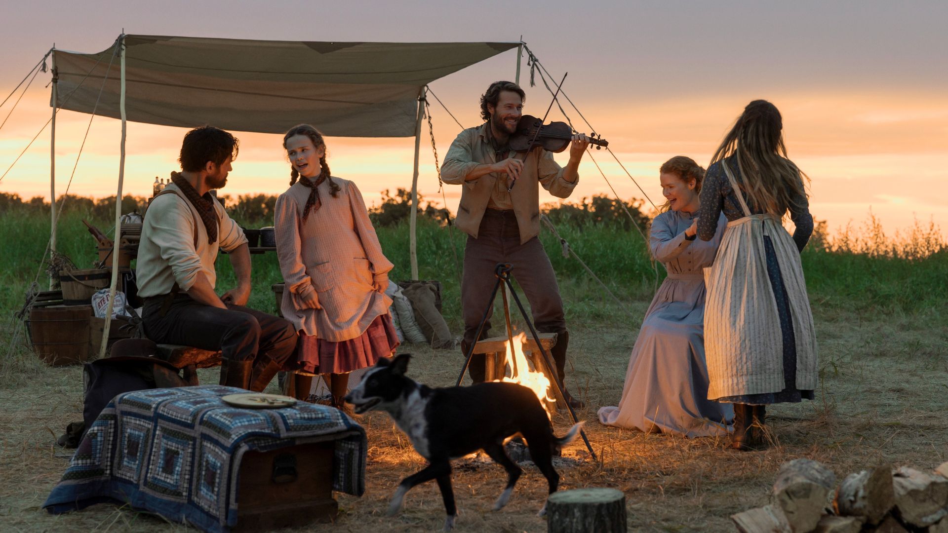 The Ingalls family dance while Charles plays the fiddle